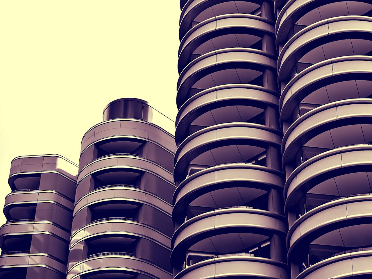 gallery-2 Stylish urban skyscraper perspective with circular balcony design and modern architecture.